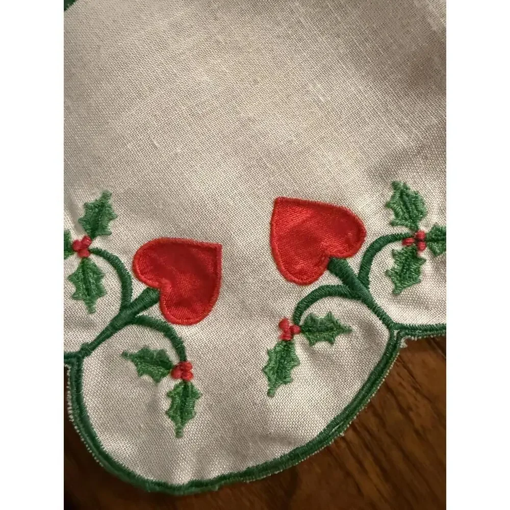 Table runner appliqued with red hearts and embroidered holly leaves 88” X 13.5”